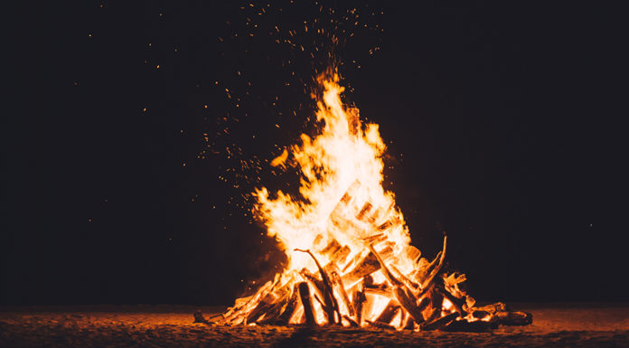 A blazing campfire at night